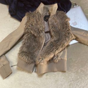 This jacket is faux fur and 100 %polyester but it is such a beautiful Jacket.